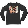 Trick Or Teach Pumpkin Candy Corn Ghost Halloween Teacher Unisex Long Sleeve T-Shirt, trending gift Trick Or Teach Pumpkin Candy Corn Ghost Halloween Teacher Unisex Long Sleeve T-Shirt, trending gift