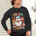Groovy Halloween Trick Or Teach Retro Floral Ghost Teacher For Men Women Kids Unisex Long Sleeve T-Shirt, gift for family, gift for coworker Groovy Halloween Trick Or Teach Retro Floral Ghost Teacher For Men Women Kids Unisex Long Sleeve T-Shirt, gift for family, gift for coworker