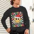 Santas Favorite Teacher Retro Groovy Smile Face Christmas Unisex Long Sleeve T-Shirt, gift for family, gift for coworker Santas Favorite Teacher Retro Groovy Smile Face Christmas Unisex Long Sleeve T-Shirt, gift for family, gift for coworker