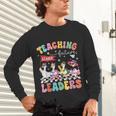 Teaching Future Leaders Groovy Teacher Back To School Unisex Long Sleeve T-Shirt, gift for family, gift for coworker