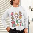 Team TK Teacher Christmas Groovy Smile Face Girl Boy Kid TK Unisex Long Sleeve T-Shirt, gift for family, gift for coworker Team TK Teacher Christmas Groovy Smile Face Girl Boy Kid TK Unisex Long Sleeve T-Shirt, gift for family, gift for coworker