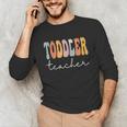 Toddler Teacher Retro Groovy Women Happy First Day Of School Unisex Long Sleeve T-Shirt, funny gift Toddler Teacher Retro Groovy Women Happy First Day Of School Unisex Long Sleeve T-Shirt, funny gift