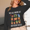 We All Grow At Different Rates Back To School Teacher Unisex Long Sleeve T-Shirt, funny design
