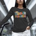 Groovy Toddler Teacher Appreciation Back To School Unisex Long Sleeve T-Shirt, novelty gifts, funny gifts Groovy Toddler Teacher Appreciation Back To School Unisex Long Sleeve T-Shirt, novelty gifts, funny gifts