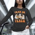 Teacher Halloween Trick Or Teach Retro Groovy Floral Ghost Unisex Long Sleeve T-Shirt, novelty gifts, funny gifts Teacher Halloween Trick Or Teach Retro Groovy Floral Ghost Unisex Long Sleeve T-Shirt, novelty gifts, funny gifts