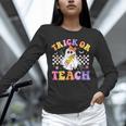 Trick Or Teach Groovy Halloween Teachers Unisex Long Sleeve T-Shirt, novelty gifts, funny gifts
