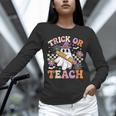 Trick Or Teach Groovy Teacher Halloween Retro Ghost Unisex Long Sleeve T-Shirt, novelty gifts, funny gifts