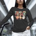 Trick Or Teach Pumpkin Candy Corn Ghost Halloween Teacher Unisex Long Sleeve T-Shirt, novelty gifts, funny gifts Trick Or Teach Pumpkin Candy Corn Ghost Halloween Teacher Unisex Long Sleeve T-Shirt, novelty gifts, funny gifts