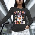 Trick Or Teach Teacher Groovy Ghost Halloween Teacher Unisex Long Sleeve T-Shirt, novelty gifts, funny gifts