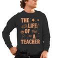 The Life Of A Teacher Back To School Women Men Men's Long Sleeve T-Shirt, trending gift The Life Of A Teacher Back To School Women Men Men's Long Sleeve T-Shirt, trending gift