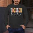 Toddler Teacher Retro Groovy Women Happy First Day Of School Men's Long Sleeve T-Shirt, funny design