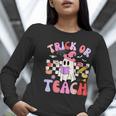 Trick Or Teach Halloween Teacher Floral Ghost Groovy Women Long Sleeve T-Shirt, Groovy Teacher Shirts, funny gift Trick Or Teach Halloween Teacher Floral Ghost Groovy Women Long Sleeve T-Shirt, Groovy Teacher Shirts, funny gift