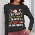 Be Nice To The Teacher Santa Is Watching Christmas Women Long Sleeve T-Shirt, funny design Be Nice To The Teacher Santa Is Watching Christmas Women Long Sleeve T-Shirt, funny design