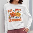 Fall In Love With Learning Thanksgiving Teacher Student Kids Women Long Sleeve T-Shirt, funny design