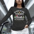 Christmas Be Nice To The Teacher Santa Is Watching Xmas Women Long Sleeve T-Shirt, gift for family, gift for coworker Christmas Be Nice To The Teacher Santa Is Watching Xmas Women Long Sleeve T-Shirt, gift for family, gift for coworker