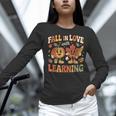 Fall In Love With Learning Retro Autumn Thanksgiving Teacher Women Long Sleeve T-Shirt, gift for family, gift for coworker