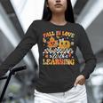 Fall In Love With Learning Fall Teacher Thanksgiving Retro Women Long Sleeve T-Shirt, gift for family, gift for coworker