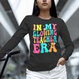 In My Glowing Teacher Era Groovy Colorful Bright Women Long Sleeve T-Shirt, Groovy Teacher Shirts, gift for family, gift for coworker In My Glowing Teacher Era Groovy Colorful Bright Women Long Sleeve T-Shirt, Groovy Teacher Shirts, gift for family, gift for coworker