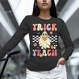 Groovy Teacher Halloween Retro Trick Or Teach Floral Ghost Women Long Sleeve T-Shirt, Groovy Teacher Shirts, gift for family, gift for coworker