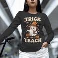Halloween Teacher Shirts Women School Trick Or Teach Groovy Women Long Sleeve T-Shirt, Groovy Teacher Shirts, gift for family, gift for coworker