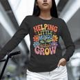 Helping Little Minds Grow Teacher First Day Back To School Women Long Sleeve T-Shirt, gift for family, gift for coworker Helping Little Minds Grow Teacher First Day Back To School Women Long Sleeve T-Shirt, gift for family, gift for coworker