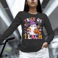 Trick Or Teach Groovy Teacher Ghost Halloween Teacher Women Long Sleeve T-Shirt, Groovy Teacher Shirts, gift for family, gift for coworker Trick Or Teach Groovy Teacher Ghost Halloween Teacher Women Long Sleeve T-Shirt, Groovy Teacher Shirts, gift for family, gift for coworker