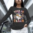 Trick Or Teach Groovy Teacher Halloween Retro Ghost Women Long Sleeve T-Shirt, Groovy Teacher Shirts, gift for family, gift for coworker