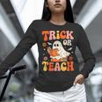 Trick Or Teach Halloween Shirt For Teacher Kids Floral Ghost Women Long Sleeve T-Shirt, gift for family, gift for coworker Trick Or Teach Halloween Shirt For Teacher Kids Floral Ghost Women Long Sleeve T-Shirt, gift for family, gift for coworker