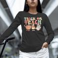 Trick Or Teach Pumpkin Candy Corn Ghost Halloween Teacher Women Long Sleeve T-Shirt, gift for family, gift for coworker Trick Or Teach Pumpkin Candy Corn Ghost Halloween Teacher Women Long Sleeve T-Shirt, gift for family, gift for coworker