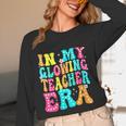 In My Glowing Teacher Era Groovy Colorful Bright Women Long Sleeve T-Shirt, novelty gifts, funny gifts In My Glowing Teacher Era Groovy Colorful Bright Women Long Sleeve T-Shirt, novelty gifts, funny gifts
