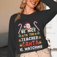 Be Nice To The Teacher Santa Is Watching Christmas Women Long Sleeve T-Shirt, novelty gifts, funny gifts Be Nice To The Teacher Santa Is Watching Christmas Women Long Sleeve T-Shirt, novelty gifts, funny gifts