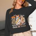 Trick Or Teach Groovy Teacher Halloween Floral Ghost Women Long Sleeve T-Shirt, novelty gifts, funny gifts