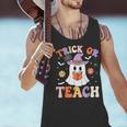 Trick Or Teach Teacher Groovy Ghost Halloween Teacher Men Tank Top, Groovy Teacher Tank Tops, gift for family, gift for coworker Trick Or Teach Teacher Groovy Ghost Halloween Teacher Men Tank Top, Groovy Teacher Tank Tops, gift for family, gift for coworker