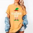 The Teacher Elf Matching Family Christmas Women's Comfort Colors T-Shirt Mustard The Teacher Elf Matching Family Christmas Women's Comfort Colors T-Shirt Mustard