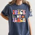 Trick Or Teach Retro Groovy Halloween Teacher Women's Comfort Colors T-Shirt Denim Trick Or Teach Retro Groovy Halloween Teacher Women's Comfort Colors T-Shirt Denim