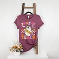 Retro Floral Ghost Trick Or Teach Groovy Teacher Halloween Women's Heather T-Shirt Heather Maroon