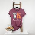 TK Teacher Retro Groovy Vintage Happy First Day Of School Women's Heather T-Shirt Heather Maroon
