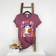 Trick Or Teach Groovy Teacher Ghost Halloween Teacher Women's Heather T-Shirt Heather Maroon Trick Or Teach Groovy Teacher Ghost Halloween Teacher Women's Heather T-Shirt Heather Maroon