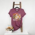 Trick Or Teach Groovy Teacher Halloween Floral Ghost Women's Heather T-Shirt Heather Maroon Trick Or Teach Groovy Teacher Halloween Floral Ghost Women's Heather T-Shirt Heather Maroon
