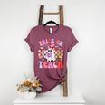 Trick Or Teach Halloween Teacher Floral Ghost Groovy Women's Heather T-Shirt Heather Maroon