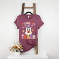 Trick Or Teach Teacher Groovy Ghost Halloween Teacher Women's Heather T-Shirt Heather Maroon Trick Or Teach Teacher Groovy Ghost Halloween Teacher Women's Heather T-Shirt Heather Maroon