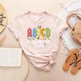 4th Grade Rocks ABCD Back To School Rock Teachers Women's Heather T-Shirt Heather Peach