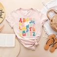 Alphabet Hi Back To School ABC Pre K Kindergarten Teacher Women's Heather T-Shirt Heather Peach Alphabet Hi Back To School ABC Pre K Kindergarten Teacher Women's Heather T-Shirt Heather Peach