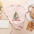 All Booked For Christmas Xmas Tree Teacher Holiday Pajamas Women's Heather T-Shirt Heather Peach