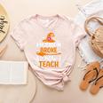 My Broom Broke So Now I Teach Halloween Teacher Women's Heather T-Shirt Heather Peach
