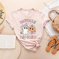 Daycare Boo Crew Groovy Halloween Floral Ghost Kid Teacher Women's Heather T-Shirt Heather Peach