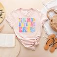 In My Daycare Era Groovy Teacher Daycare First Day Of School Women's Heather T-Shirt Heather Peach In My Daycare Era Groovy Teacher Daycare First Day Of School Women's Heather T-Shirt Heather Peach