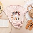 Fall Holiday Themed Thanksgiving Halloween Teacher Trick Or Women's Heather T-Shirt Heather Peach