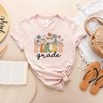 First Grade Teacher Wildflower Back To School Floral Outfits Women's Heather T-Shirt Heather Peach First Grade Teacher Wildflower Back To School Floral Outfits Women's Heather T-Shirt Heather Peach
