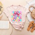 Groovy Teacher Cute Coquette Bow Flower Retro Back To School Women's Heather T-Shirt Heather Peach Groovy Teacher Cute Coquette Bow Flower Retro Back To School Women's Heather T-Shirt Heather Peach